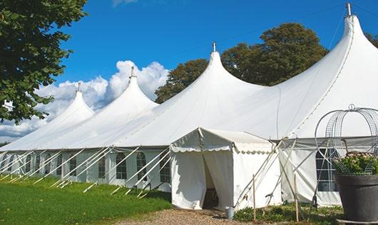 a line of sleek and modern portable toilets ready for use at an upscale corporate event in Cliffwood